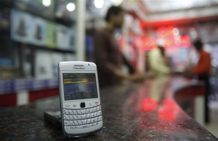 FILE In this Friday, Aug. 27, 2010 file photo, a dummy BlackBerry handset stands at a shop in Hyderabad, India. Large numbers of BlackBerry users across Europe, the Middle East and Africa have been cut off from Internet and messaging services, phone companies in the affected regions said Monday, Oct. 10, 2011. BlackBerry maker Research in Motion Ltd. gave few details beyond a brief statement saying that customers were \"experiencing issues,\" but telecommunications companies in the Middle East and Europe laid the blame at the Canadian company's door. (AP Photo/Mahesh Kumar A., File)